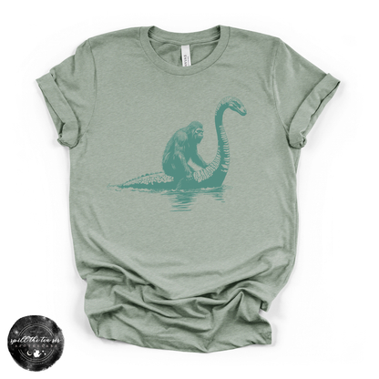 Bigfoot Riding Nessy Tee | Funny Cryptid Graphic T-Shirt